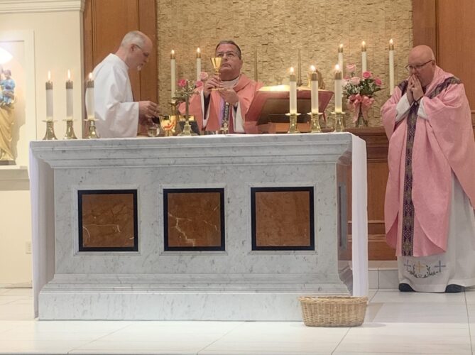 Bishop performs Mass in East Palestine
